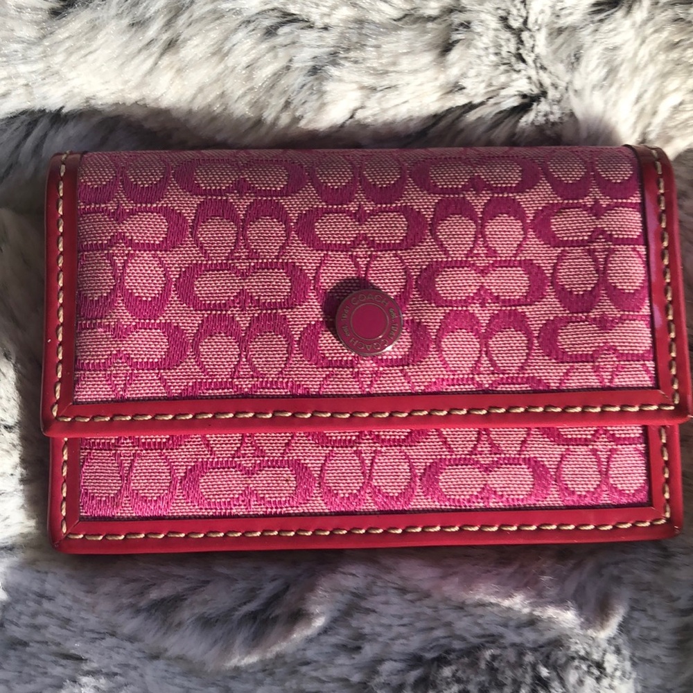 Pink Coach card holder.